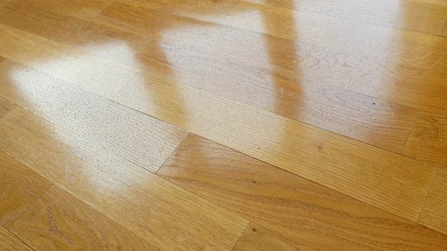 Parquet. Drops of water on wooden surface.