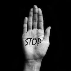 Black and white open hand with text Stop