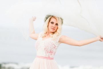 Happy and beautiful wife on the beach