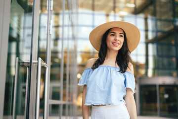 Beautiful woman wearing a hat outdoors