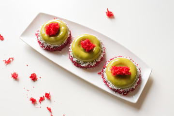 Beautiful tasty cakes on the plate close-up