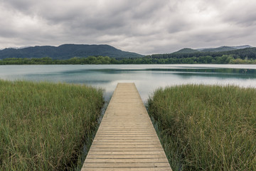 wooden walkway leading to the lake. Vanishing point