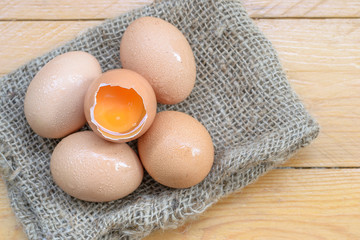 Fresh eggs on a wooden rustic background