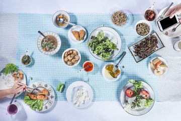 Top view of people eating food together.
