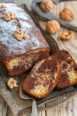 Homemade chocolate cake with nuts and orange zest.