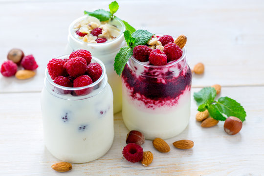 Homemade yoghurt with raspberries, walnuts and mint.