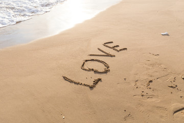 love message written in sand