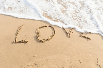 love message written in sand
