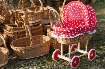 pushchair and baskets of straw