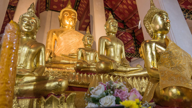 Buddha gold statue and thai art architecture in Wat Arun buddhist temple in Bangkok, Thailand.Selective focus.