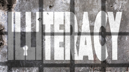 Illiteracy Written On A Wall With Jail Bars Shadow