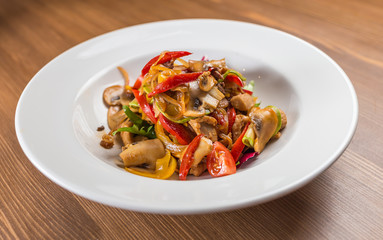 salad with mushrooms on white plate