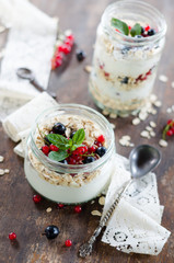 yogurt with berries and products for healthy breakfast, close-up
