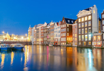 Fototapeta na wymiar Amsterdam. Night view of the houses along the canal.