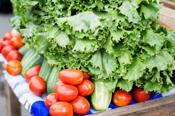 fruits and vegetables arranged on a table at the market.