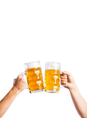 Two unrecognizable men clinking with beer mugs, studio shot