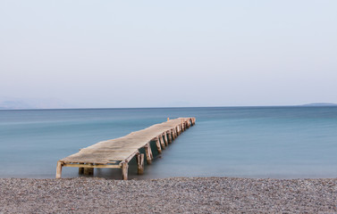 Wooden jetty at Ipsos beach, Corfu island, Greece