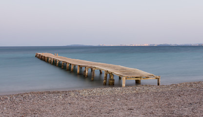 Wooden jetty at Ipsos beach, Corfu island, Greece