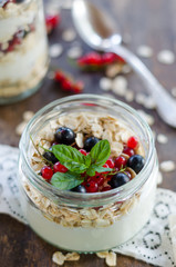 yogurt with berries and products for healthy breakfast, close-up
