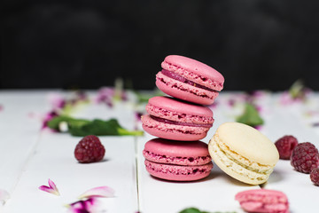 Macaroon on a white wooden background, horizontal, selective focus