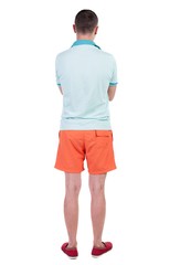 Back view of handsome man in shorts. Rear view people collection.  backside view of person.  Isolated over white background.