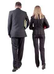 Back view of walking business team. Going young couple in suit with books go get an education. Rear view people collection. backside view of person. Isolated over white background