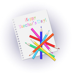 Scattered colored pencils on a white sheet notepad. Inscription happy Teachers' Day.