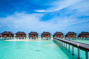 beach with water bungalows at Maldives