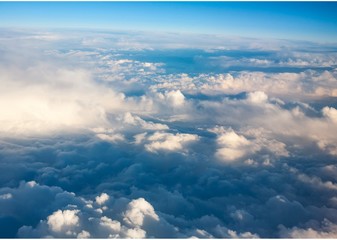 Fototapeta na wymiar clouds. top view from the window of an airplane flying in the clouds. cloud spreading to the horizon