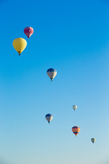  air balloons flying over the valley at Cappadocia