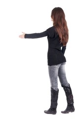 back view of businesswoman  reaches out to shake hands. Rear view people collection. backside view of person. Isolated over white background.