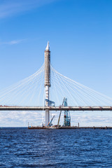 Construction of Cable-stayed bridge over Petrovsky waterway across river Neva as part of the Western High Speed Diameter in St. Petersburg
