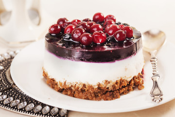 cake with cranberry jelly cream round shape berries closeup