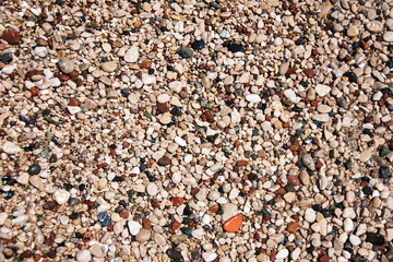 stones on beach and sea water