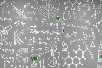 chemical formulas drawn on the gray wall