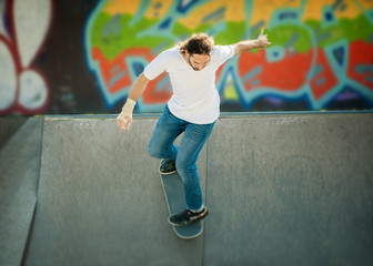 Skateboarder riding in skate park