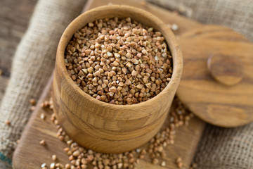 buckwheat groats on wooden surface