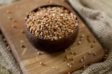 buckwheat groats on wooden surface