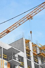 Crane and highrise construction site