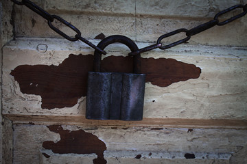door locked with padlock and chains