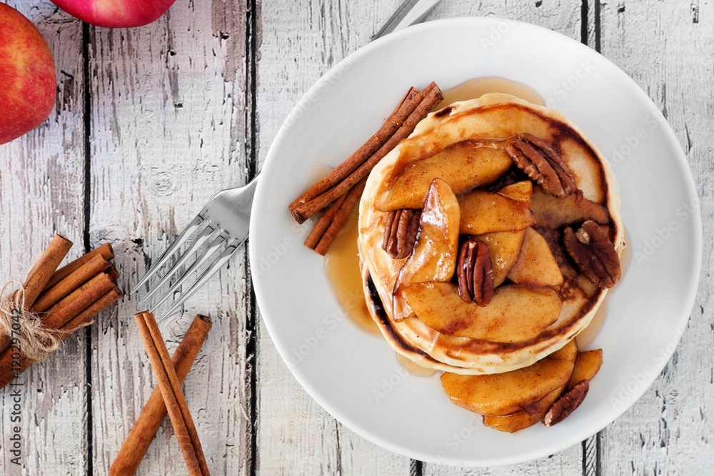 Aufkleber autumn pancake stack with baked apples, pecans and cinnamon topped with maple syrup, overhead view