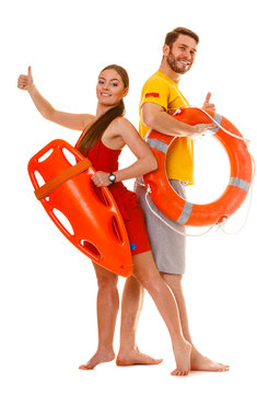 Lifeguards with rescue and ring buoy lifebuoy.