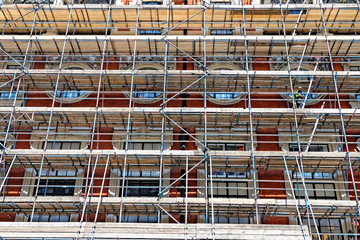Fragment of scaffolding against house wall in Central London