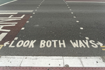 Look both ways inscription on the road.