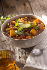 Bowl of Chili Soup with Glass of Brandy