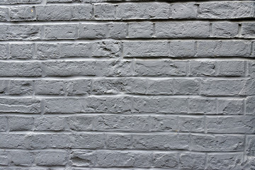 Grey brick wall background.