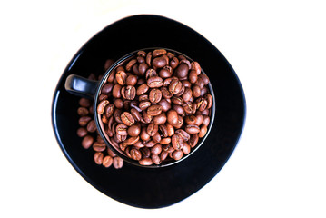 Coffee mug full of coffee beans