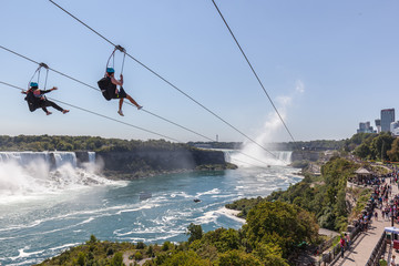 Two Unrecognisable people taking zipline ride at Niagara Falls, Ontario, canada.
New zipline in Niagara Parks opened in the summer of 2016