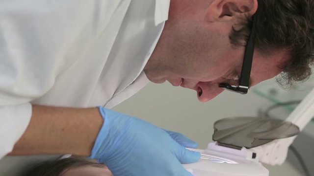 Doctor examines girl on papilloma