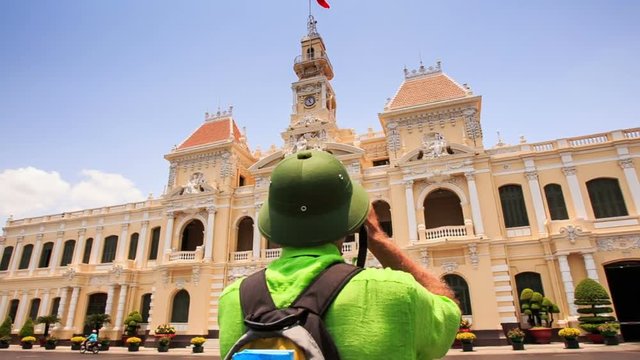 Old Man in Hat Photos Ho Chi Minh City Hall from across Street